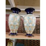 A pair of Royal Doulton stoneware vases.