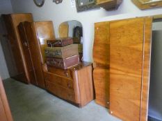 A mid 20th century bedroom suite comprising 2 wardrobes,