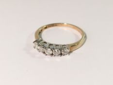 An 18ct gold ring set 5 diamonds, size N.