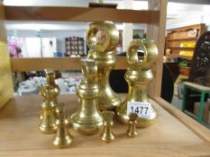 A set of 8 brass bell weights,.
