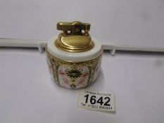 A Royal Crown Derby table lighter.