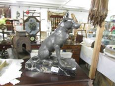A spelter figure of a dog on marble base.