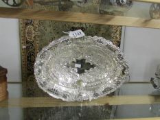 An ornate silver plated basket.