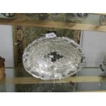 An ornate silver plated basket.