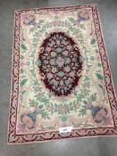 A large embroidered silk rug (1.8m x 1.