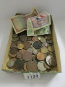 A large quantity of UK and foreign coins including pre 1947 silver 3d bits and 3 bank notes.