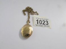 A 9ct gold locket on 9ct gold chain, 11 grams.