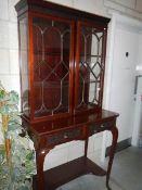 A Victorian mahogany astragal glazed cabinet on stand.