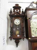 A mahogany wall clock.