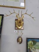 2 wall mounted brass stags.