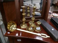 A pair of Victorian brass candlesticks, a pair of squat brass candlesticks,