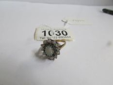 A 9ct gold floral cluster ring set opal, size P.