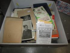 A box containing a large amount of mixed ephemera including postcards of military and civil