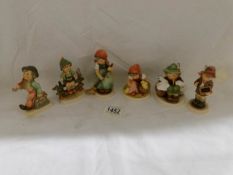6 Hummel Goeble figures being Wayside Harmony, Playmates, Merry Wanderer, Little Sweeper,