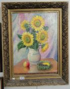 A 20th century oil on canvas still life featuring sunflowers with Russian detail to frame and