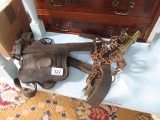 A working horse blinkers and an old brass whip holders,.