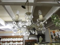 A 5 lamp glass chandelier.
