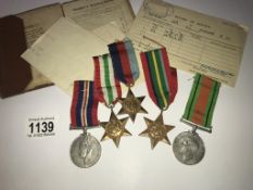 A set of 5 WW2 medals including Italy, Pacific and 1939-45 stars for Cpl. E.W.