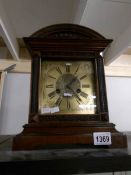 A brass faced mantel clock.