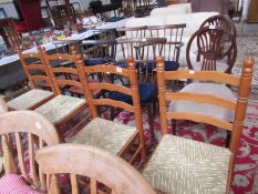 A set of 4 pine ladderback chairs with rush seats.