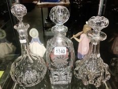 3 glass decanters.