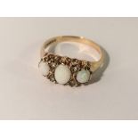 A 9ct gold ring set 3 opals, size S.