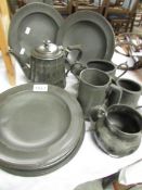 A quantity of early pewter plates and other metalware.