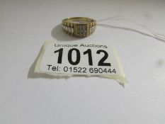 A Gent's 9ct gold ring set 9 diamonds, size V.