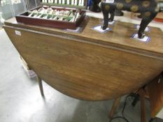 An oak gate leg table.