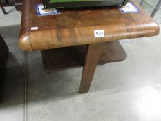 A small walnut art deco table.