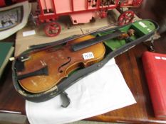 A circa 1900 Amati copy violin with 'Aubert a Mirecourt' bridge complete with bow and case.