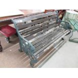 A metal and wood garden bench.