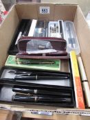 A large quantity of fountain pens.