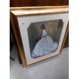 A gilt framed and glazed print of a lady in ball gown.