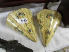 A pair of Victorian/Edwardian hand painted papier mache' wall pockets.