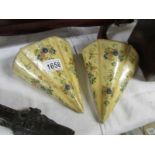 A pair of Victorian/Edwardian hand painted papier mache' wall pockets.