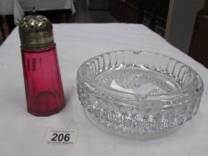 A glass 'waterfall' bowl and a cranberry glass sugar sifter.