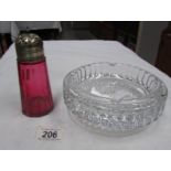 A glass 'waterfall' bowl and a cranberry glass sugar sifter.