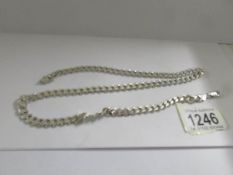A silver Kerb link chain (25"), 62.2 grams.
