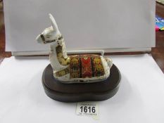 A Royal Crown Derby paperweight, Llama on wooden base.