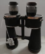 A pair of German binoculars with Nazi Germany Reichsadler eagle emblem.