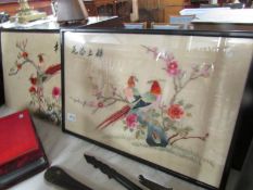 A framed and glazed Chinese embroidery and an unframed example.