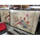 A framed and glazed Chinese embroidery and an unframed example.