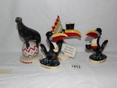 3 Royal Doulton Guinness toucans and a Coalport Guinness sealion.