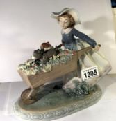 A Lladro girl with wheelbarrow and puppies, 5460.