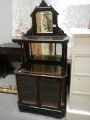 A Victorian ebonised cabinet.