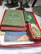 A quantity of stamp albums with contents, tins of stamps etc.