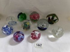 10 glass paperweights.