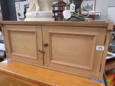 A Victorian pine 2 door cabinet.