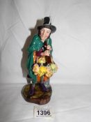 A Royal Doulton figurine, The Mask Seller, HN2103.